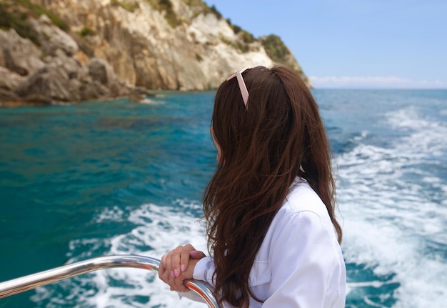 Woman on the upper deck of a cruise ship