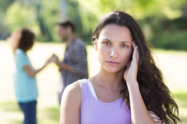 Photo woman upset at her crush with other girl