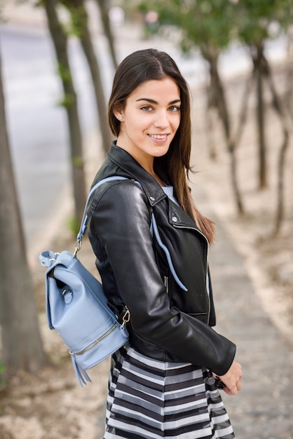 Woman in urban background wearing casual clothes