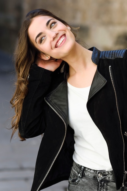 Woman in urban background wearing casual clothes