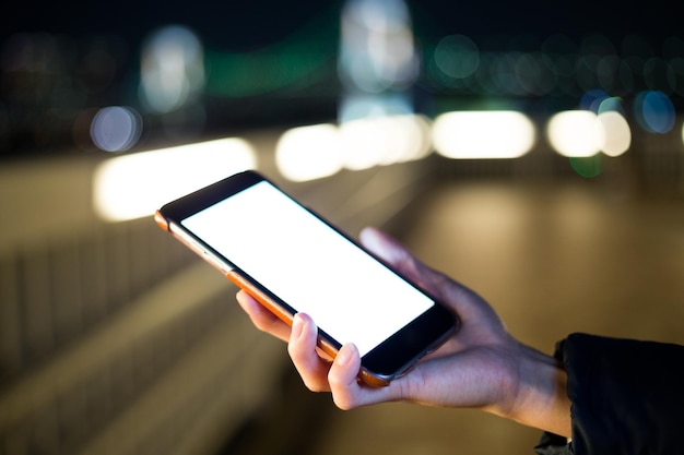 Woman use of cellphone at night