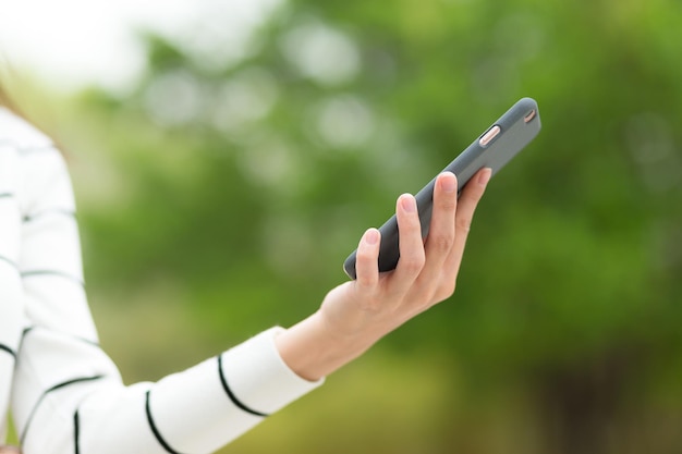 Woman use of cellphone at park