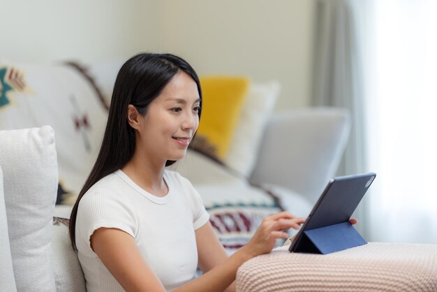 Woman use of digital tablet at home