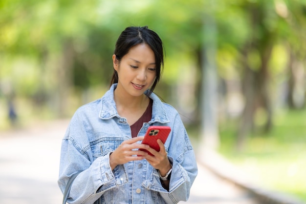 Woman use of mobile phone in city