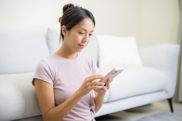 Woman use mobile phone at home