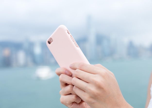 Woman use of mobile phone in Hong Kong city