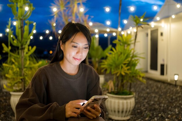 Woman use of mobile phone in hotel