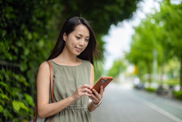 Woman use of mobile phone at outdoor