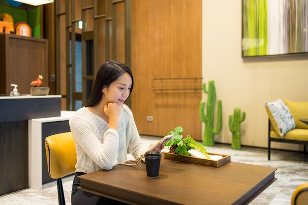 Woman use of mobile phone in restaurant