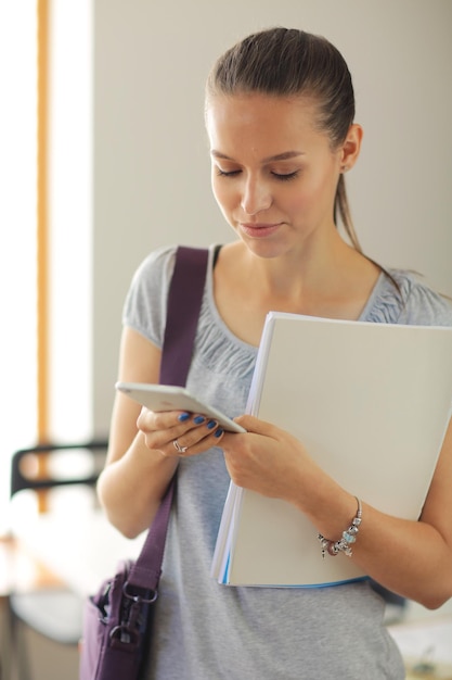 Woman use of mobile phone in university Student woman