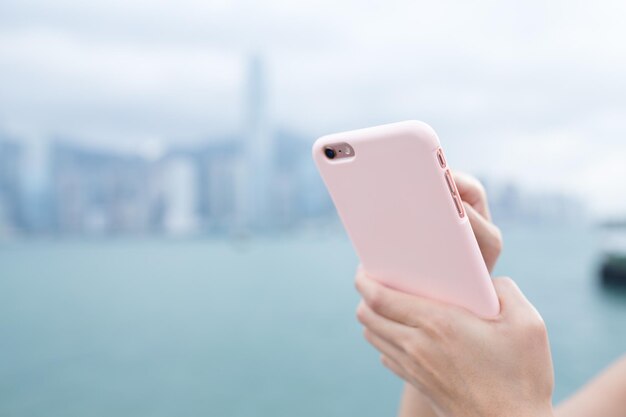 Woman use of smart phone in Hong Kong city