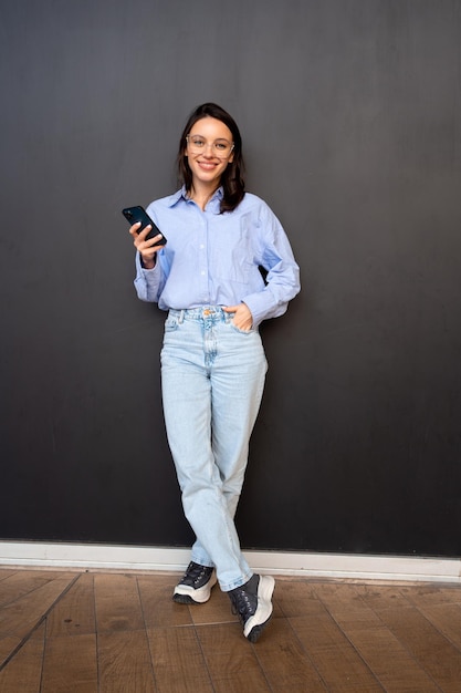 Woman use smartphone Full length