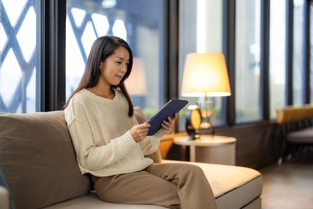 Woman use tablet computer at home