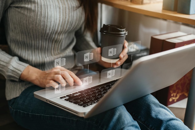 Woman uses a laptop to search for information in the home in the morning.