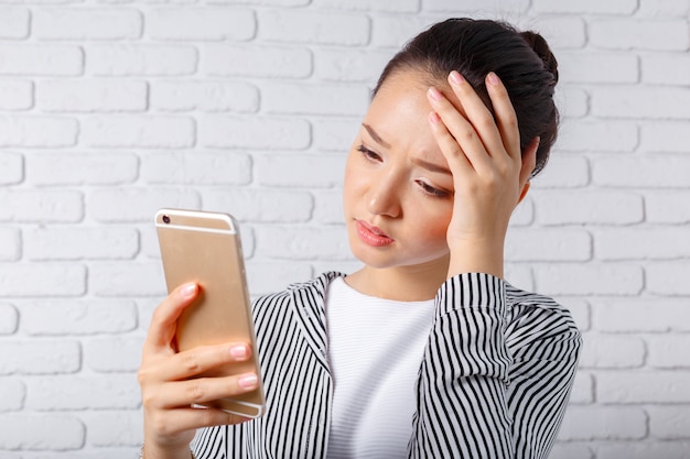 Woman uses a smartphone