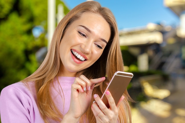 Woman uses a smartphone