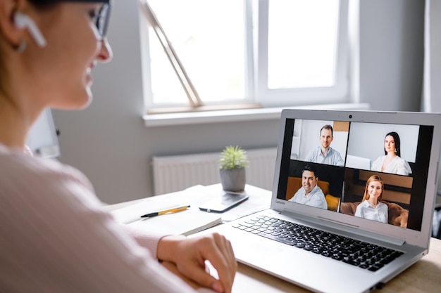 Woman using app for video call to several people