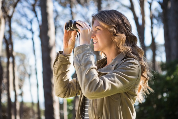 Woman using binoculars