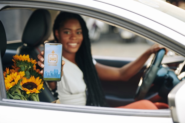 Woman using car sharing app