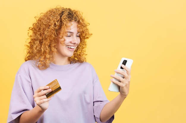 Woman using a card to shopping online with the mobile