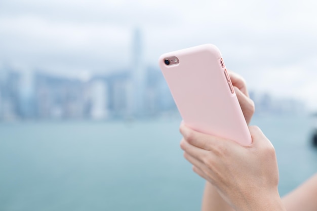 Woman using cellphone browsing online