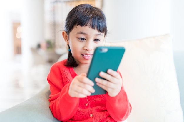 Woman using cellphone at home