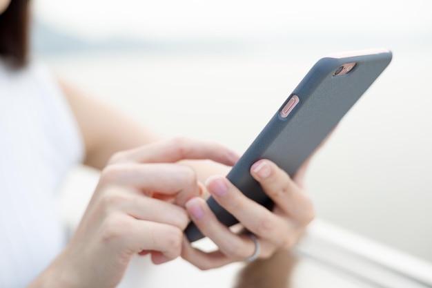 Woman using cellphone at outdoor