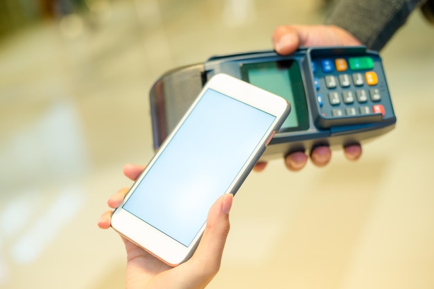 Woman using cellphone for payment