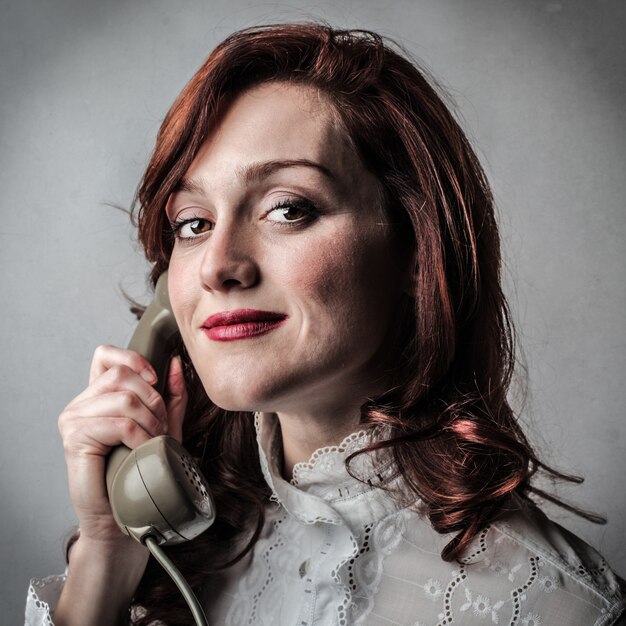 Woman using a classic phone