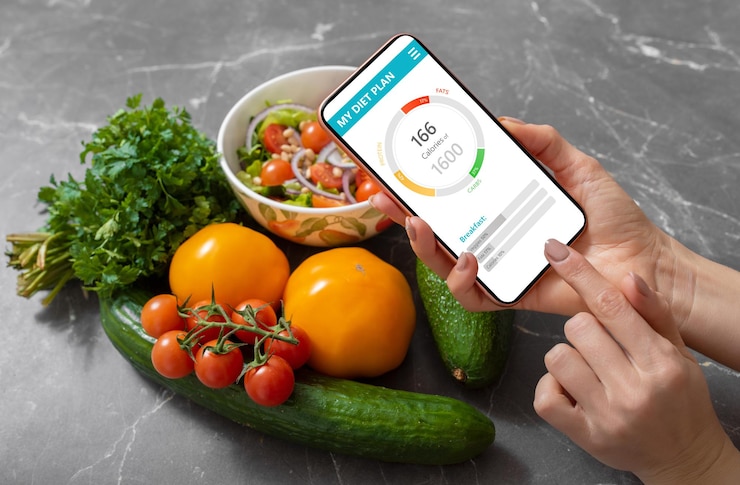 Photo woman using dieting app to track nutrition facts and calories in her food