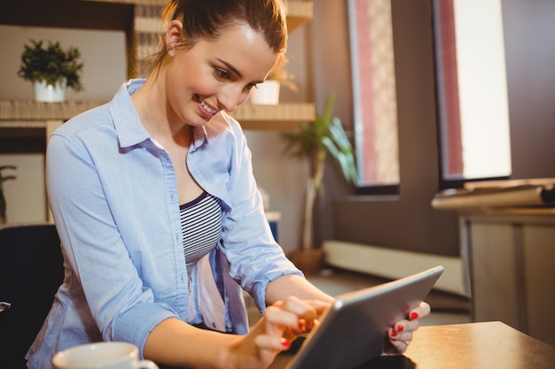 woman using digital tablet