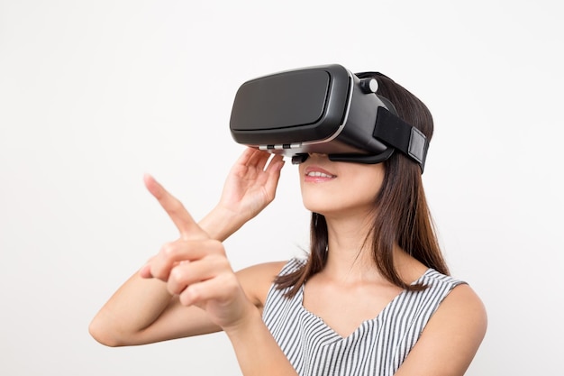 Woman using finger to touch on imaginary panel viewing on VR device