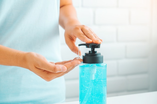 Woman using hand sanitizer