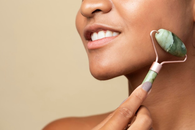 Woman using a handheld massaging tool