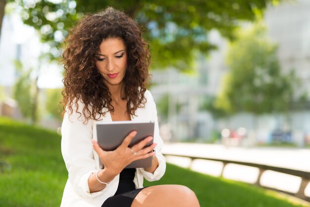 Woman using her tablet computer