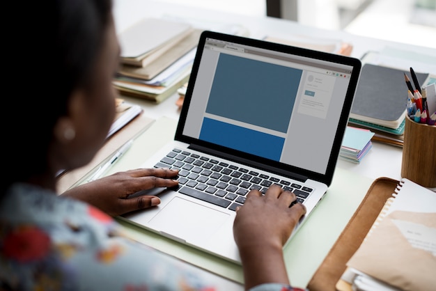 Woman using laptop connecting website