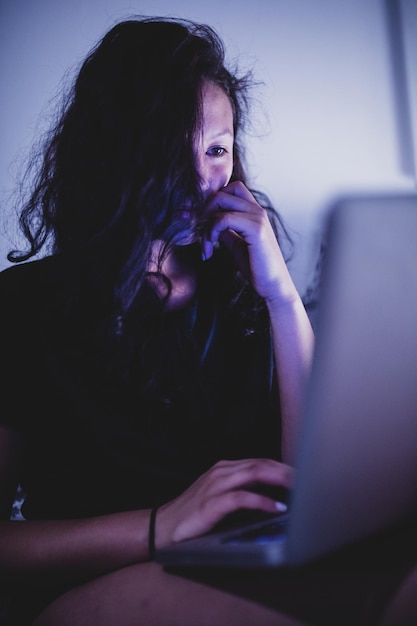 Woman using laptop at home