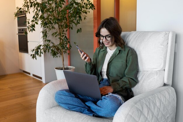 Woman using laptop at home