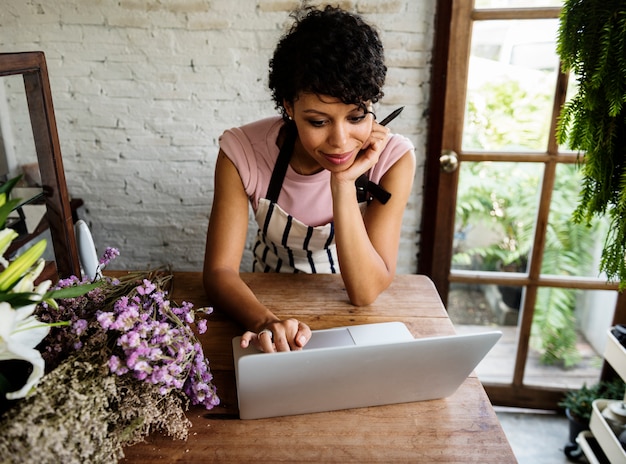 Woman Using Laptop Online Flower Shop