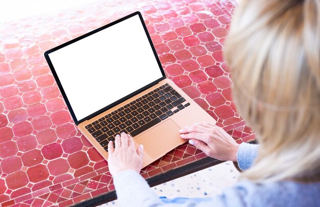 Woman using laptop screen mockup