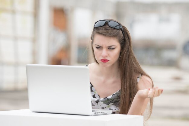 Woman using laptop on table