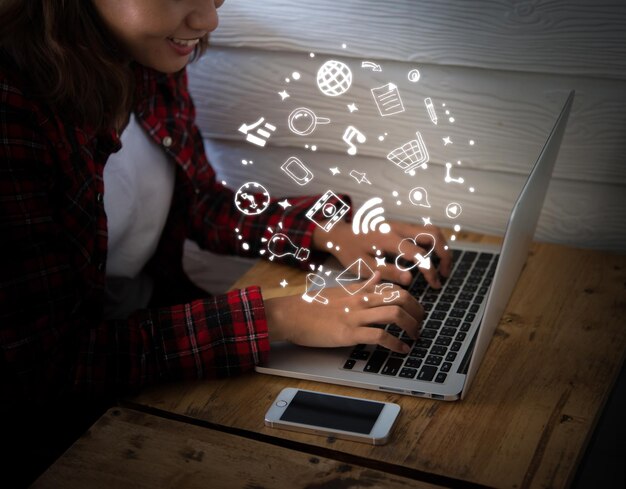 Woman using laptop at table