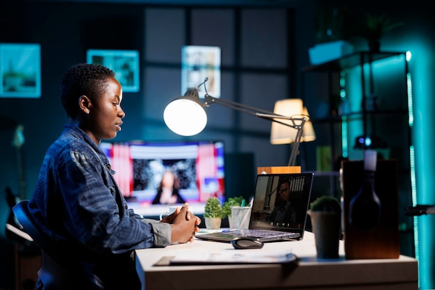 Woman using laptop for video conference