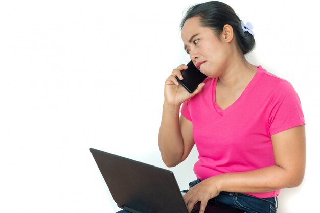 Woman using laptop on white 