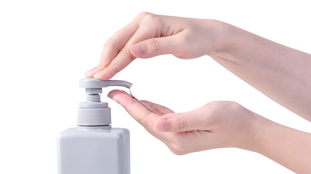 Woman using liquid soap to wash hands