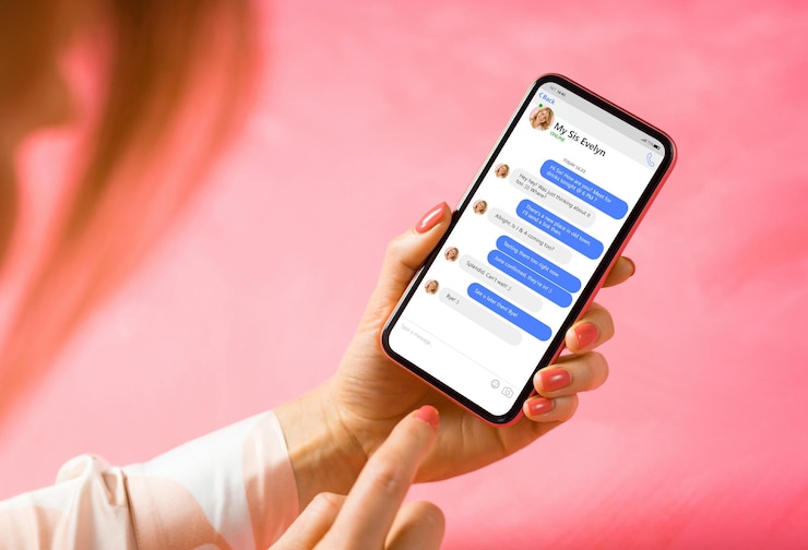 Photo woman using messaging app on mobile phone mockup of sample chat application interface