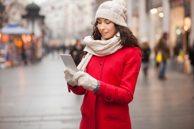 woman using mobile phone in city