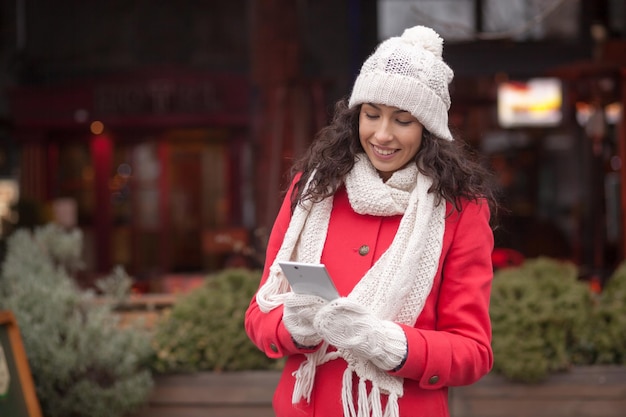 woman using mobile phone in city