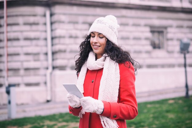 woman using mobile phone in city