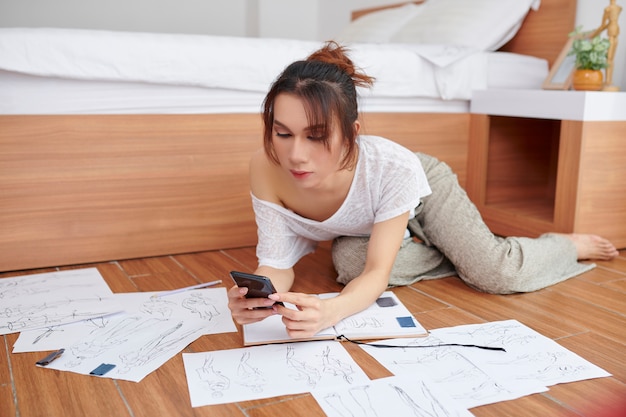 Woman using mobile phone for her work